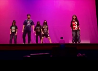 Arya Walker (wearing shorts) performing at the Falcons' Got Talent competition in February 2022