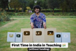 Aman Dhattarwal posing with his YouTube play buttons