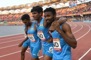 Amoj Jacob (centre) taken off the track by his teammates at Commonwealth Games 2018