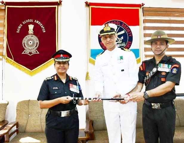 Col Mitali Madhumita receiving a baton as the principal of Sainik School, Ambikapur