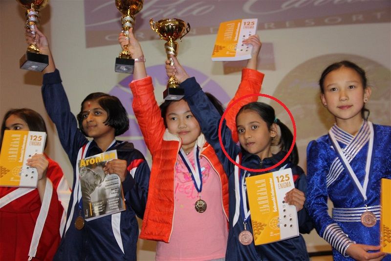 Divya Deshmukh posing with World Youth in the U- 10 girls category trophy
