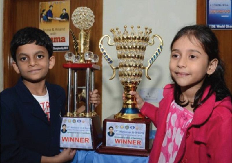 Divya Deshmukh posing with her trophy won at National Championship 2013