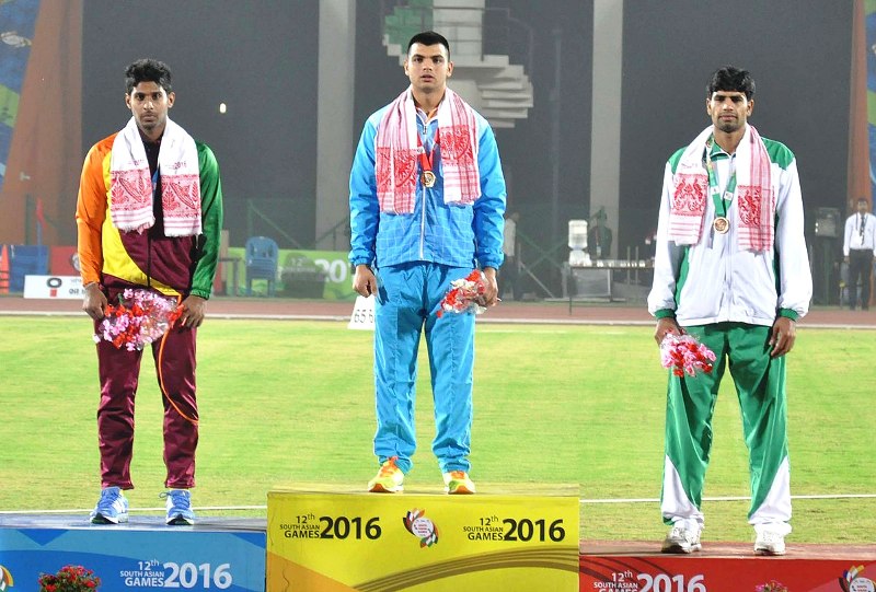 Gold medalist Neeraj Chopra of India (center), Silver medalist D.S. Ranasinghe of Sri Lanka (left) and Bronze medalist Arshad Nadeem of Pakistan at the 2016 South Asian Games (Guwahati)