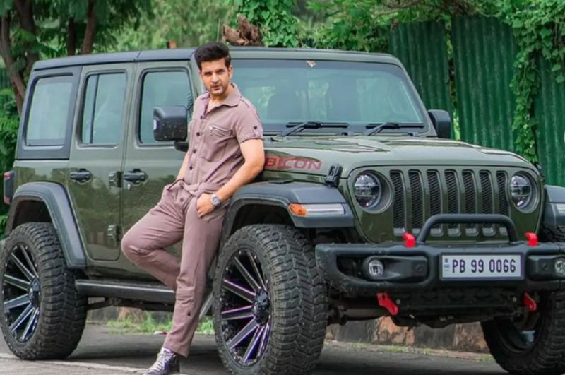 Karan Kundrra posing with his Jeep Wrangler