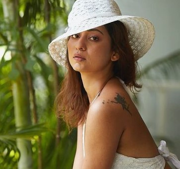 Kiran Yogeshwar featuring a tattoo on her left shoulder