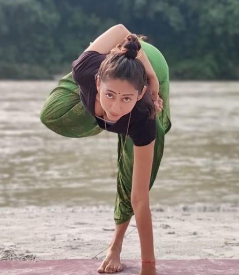 Kiran Yogeshwar while practicing a yoga posture