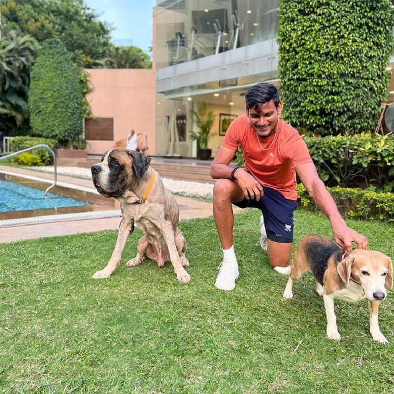 Kuldeep Sen posing with his dogs