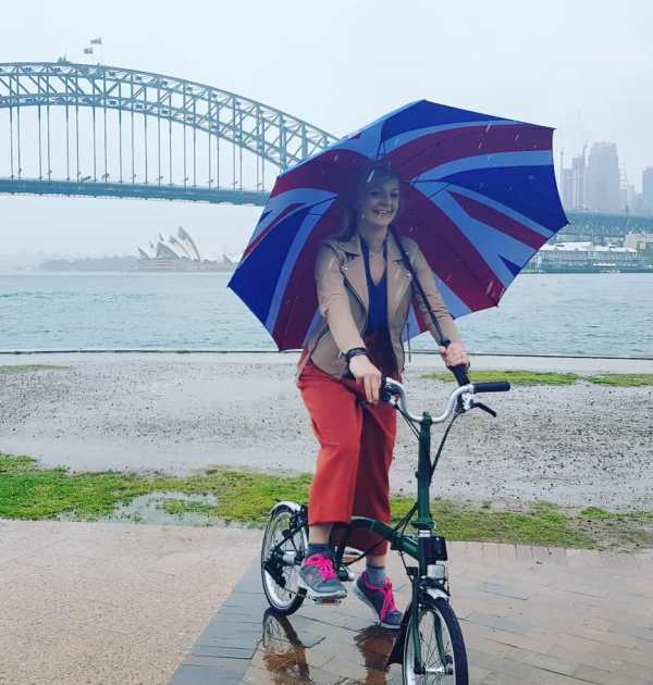 Liz in a picturer captured in front of the Sydney Harbour Bridge under the rain