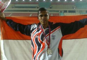 Noah posing with his silver medal at the Junior South Asian Athletic Championship in Ranchi in 2013