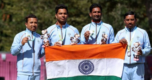 Silver medalists Sunil Bahadur, Navneet Singh, Chandan Kumar Singh (second from right), and Dinesh Kumar of India pose during Men's Fours Lawn Bowls - medal ceremony of Birmingham 2022 Commonwealth Games