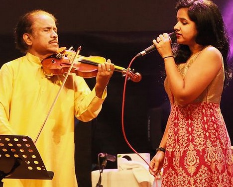 Subramaniam performing at with his daughter, Bindu