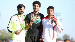 Tejaswin Shankar posing with his gold medal at the National Institute of Sports in Patiala