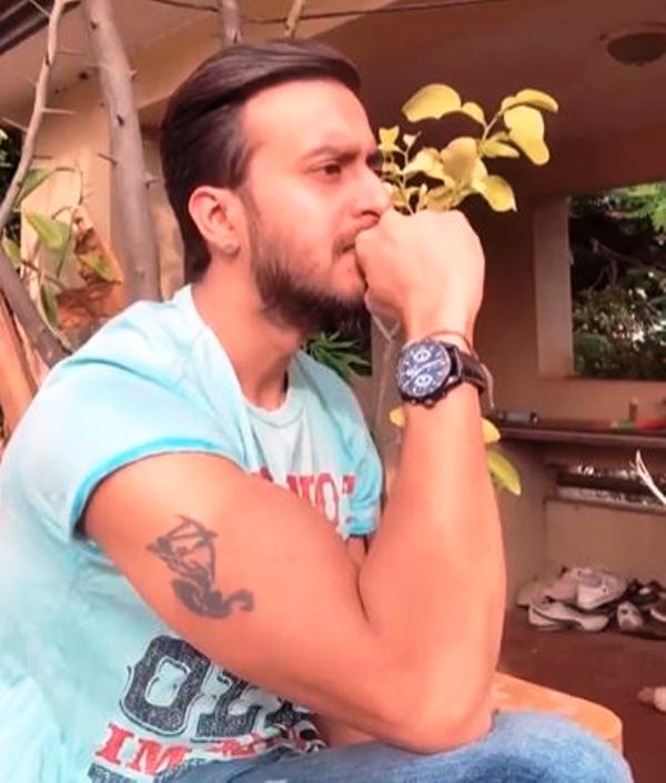 Uday Surya's biceps tattoo