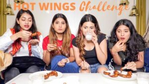 A challenge video posted by Aashna Hegde (second from right) with her sisters in which they are seen eating hot chicken wings