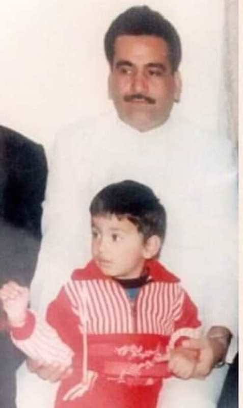 A childhood photo of Lakshay with his father