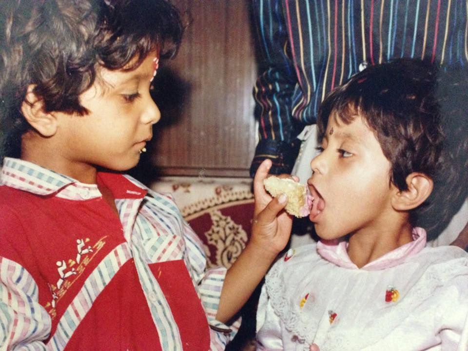 A childhood photograph of Neha Vaishnav (right)