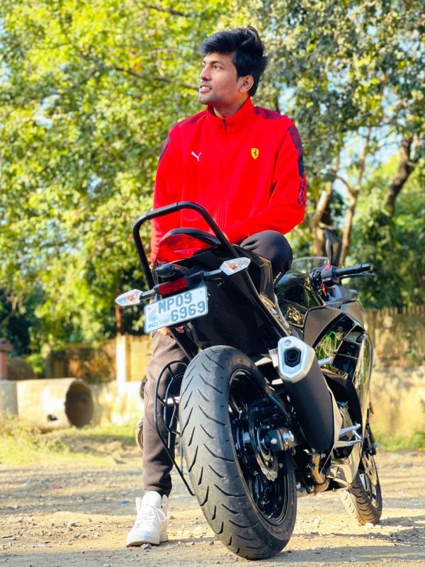 Abhiyuday Mishra posing with his bike