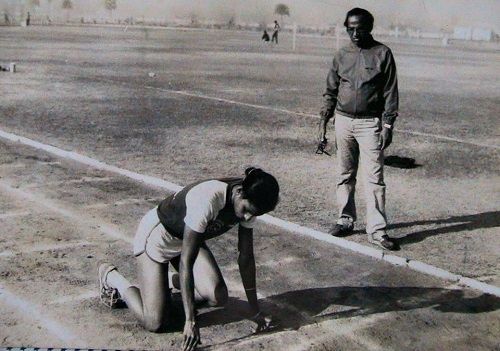 An old photo of P. T. Usha while practicing with her coach