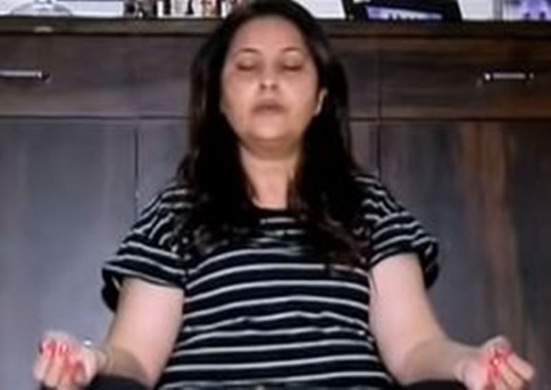 Neelu Kohli practicing yoga at her home