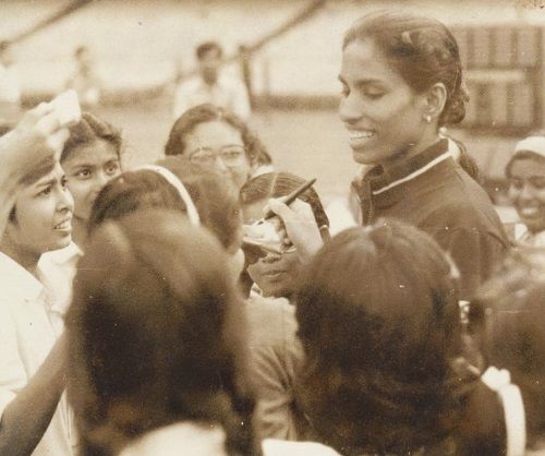 P. T. Usha while giving an autograph to her fans
