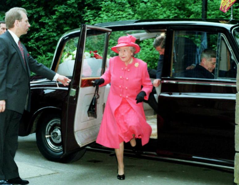 Queen Elizabeth II getting out of Rolls Royce Phantom IV State Landaulette