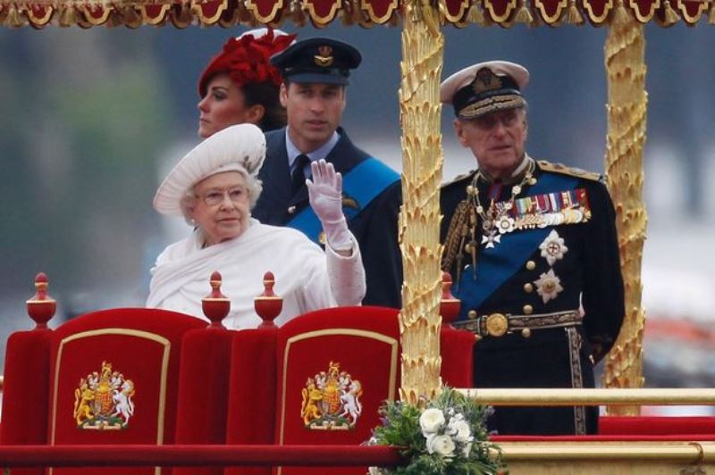 Queen Elizabeth waving at people during on the occasion of her Diamond Jubilee celebrations