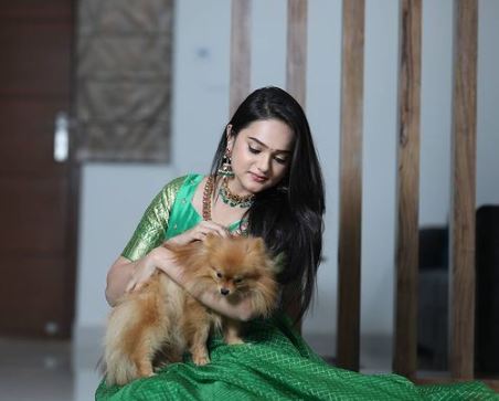 Sri Satya with a dog