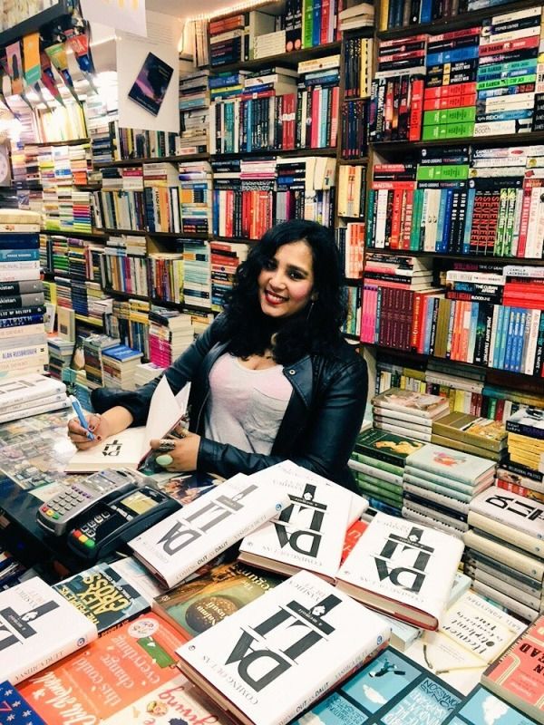 Yashika Dutt signing copies of her book at a bookstore in Delhi