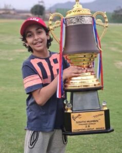 Aarrian Sawant posing with his trophy after winning the South Mumbai Premier League cricket tournament