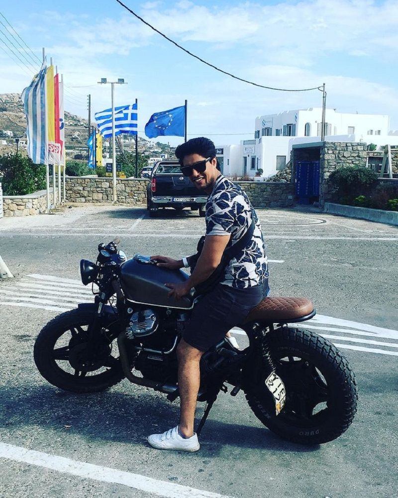 Ankit Gupta posing on his bike