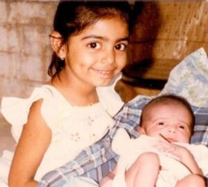 Childhood picture of Divya Maderna with her sister Rubal Maderna (infant)
