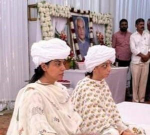 Divya Maderna (left), along with her sister, Rubal Maderna, at her father's turban ceremony (rasam pagri)
