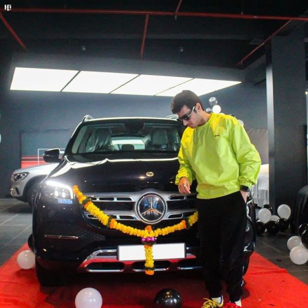 Divyendu Sharma with his Mercedes Benz SUV