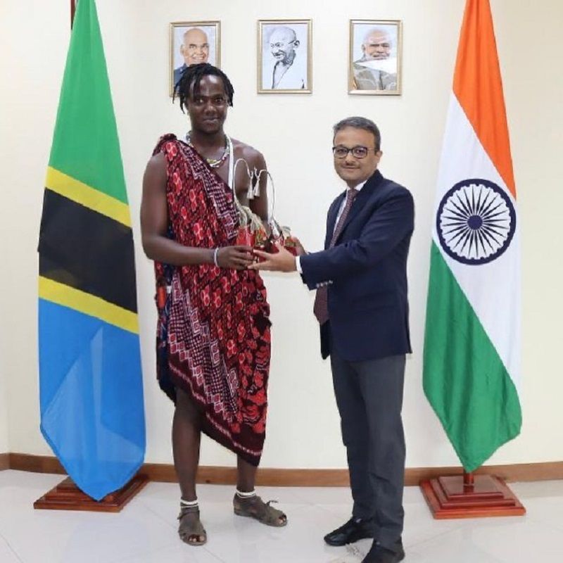 Kili Paul receiving honour from diplomat Binaya Pradhan