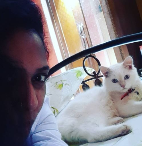 Megha Ghadge with her pet cat Snow