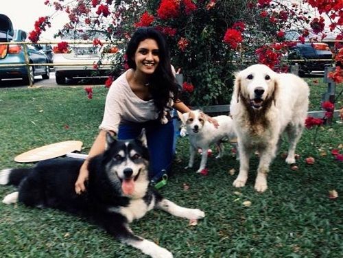 Nivaashiyni with her pet dogs