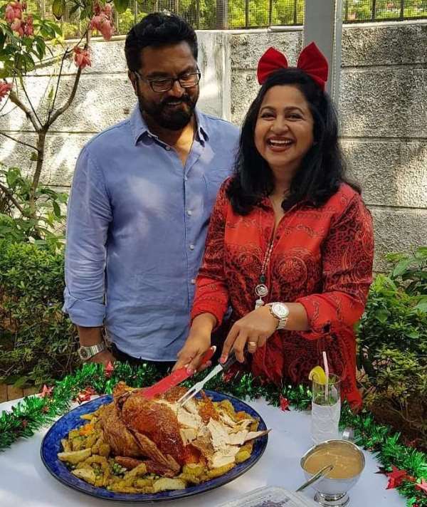 R. Sarathkumar with his wife Raadhika carving turkey on the occasion of thanksgiving