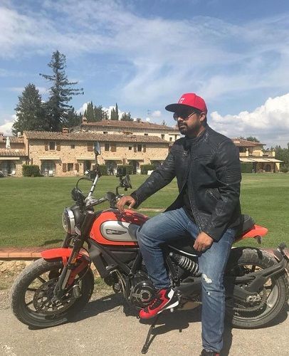 Rannvijay Singha posing on his Ducati motorcycle