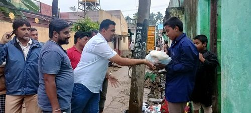 Rupesh Rajanna giving donation to the needy people