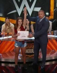 Sara Lee with Triple H poses after winning the Tough Enough contest