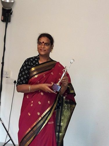 Shreegauri Sawant holding her award