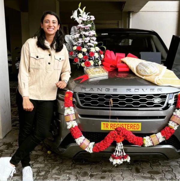 Smriti Mandhana posing with her brand new Range Rover