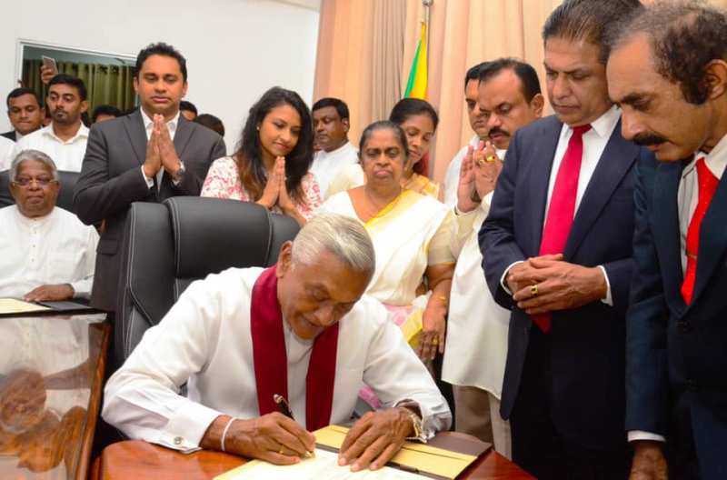 A photo of Chamal Rajapaksa taken when he was signing a document after being appointed the Minister of Irrigation