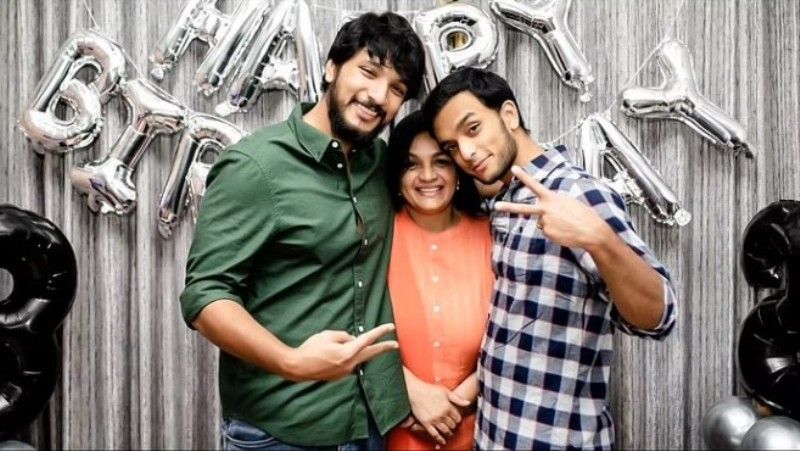From left, Gautham Karthik, his mother, and brother Thiran Karthik