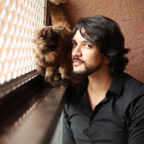 Gautham Karthik and his pet cat, Luna