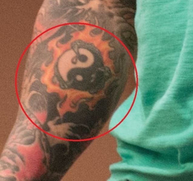 Jason David Frank's Yin-Yang ball tattoo on right forearm