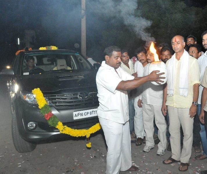 Jayadev Galla standing near his car