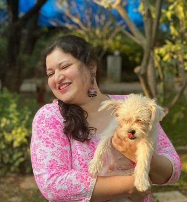 Priyadarshini and her pet dog, Pluto