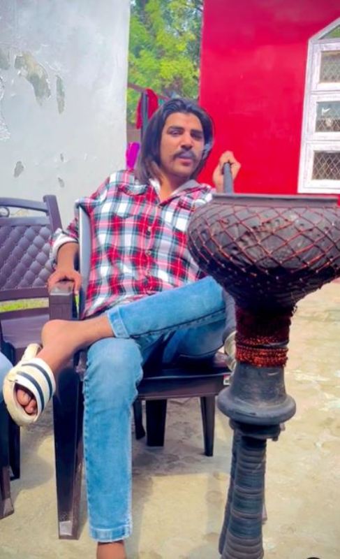 Rohit Bhati while smoking hookah