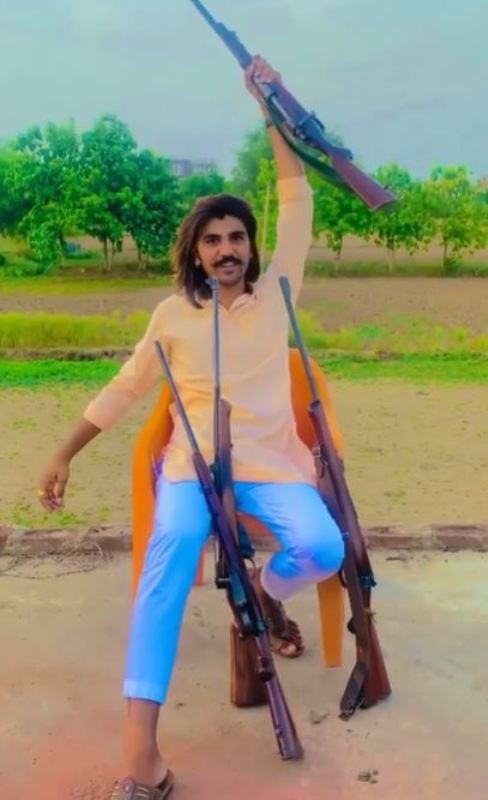 Rohit Bhati with rifles